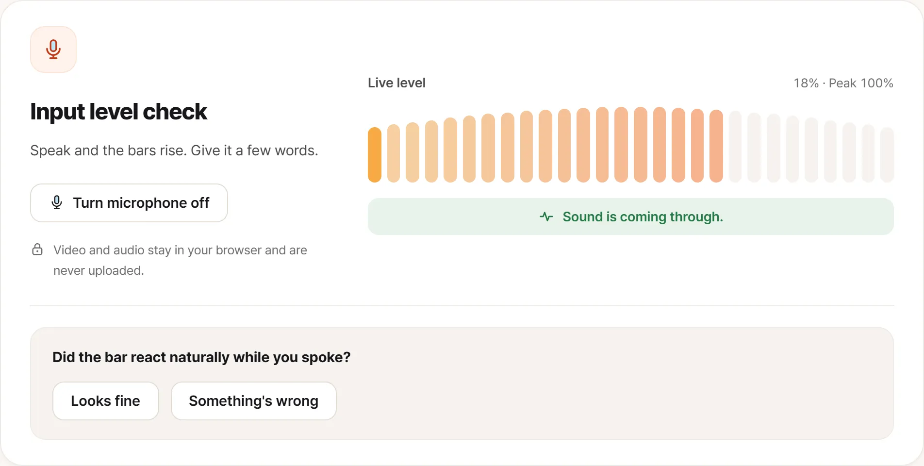 The microphone test with audio arriving. A live level meter is moving with “peak 100%” beside it, and a line below it says the sound is coming through clearly.